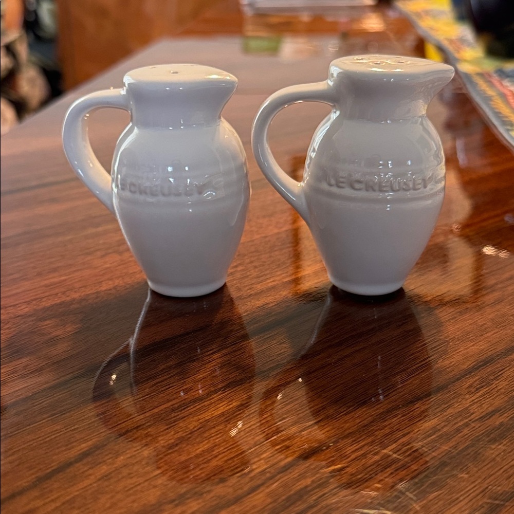 Le Cruset white salt and pepper shakers